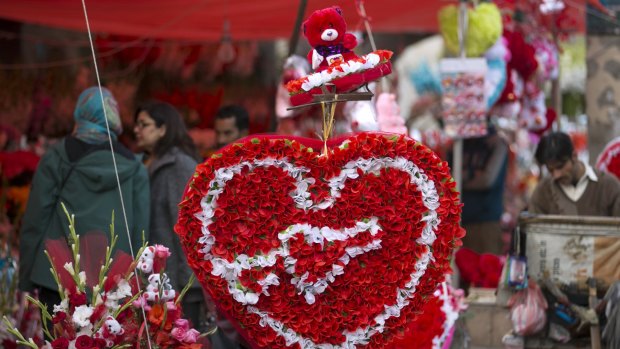 People buy flowers to celebrate Valentine's Day in Islamabad, Pakistan, on Friday. Celebrating Valentine's Day is considered un-Islamic in Pakistan, but many still buy flowers and exchange gifts with others at this time of year. 
