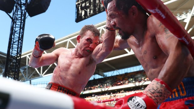  Jeff Horn  punches Manny Pacquiao during their fight  at Suncorp Stadium.  