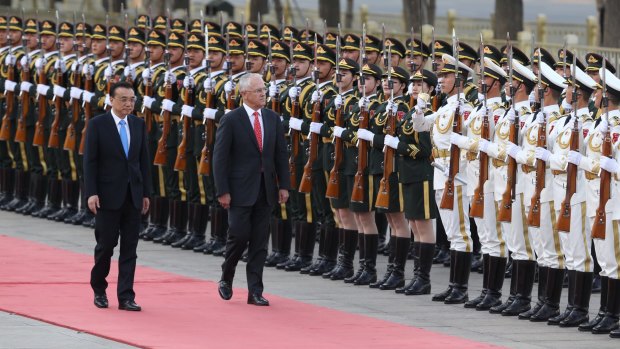 Malcolm Turnbull, with Premier Li Keqiang, receives a ceremonial welcome at the Great Hall of the People in Beijing.