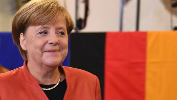 German Chancellor Angela Merkel smiles as she casts her vote in Berlin.