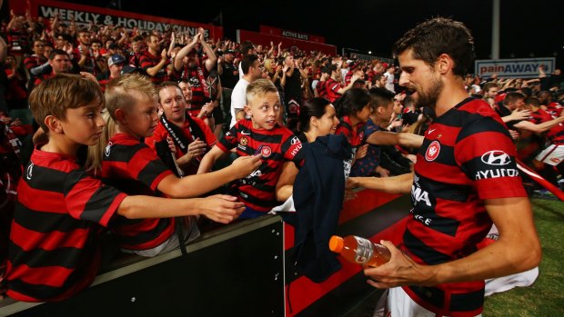 Devoted fans: Andreu interacts with Wanderers fans. Western Sydney will have to find a new home when renovations at Pirtek Stadium begin later this year.