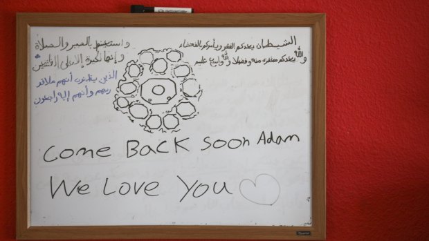 A whiteboard in Adam Shafi's room with scripture from the Koran as well as a note from his younger sister Nora in Fremont, California.