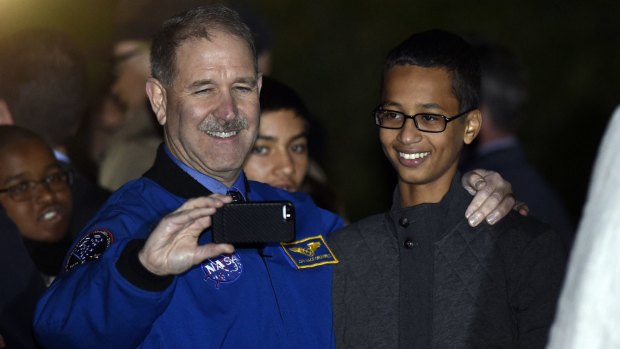 John M. Grunsfeld, left, NASA's Associate Administrator for the Science Mission Directorate, takes a photo with Ahmed Mohamed, right.