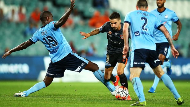 Flash of skill: Brisbane's Jamie Maclaren cuts inside Sydney FC defender Jacques Faty.