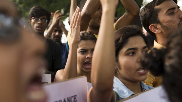 Indian students shout slogans during a protest against the latest attacks, in New Delhi on Sunday.