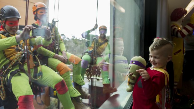 Ninja turtles fan Mason was among children delighted by the outdoor antics of window washers including Marc Larouche, Tim Booth and Reece Stevens at Ronald McDonald House.
 
