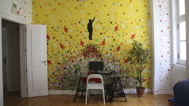 Colourful, subversive murals hint at the hostel's creative roots