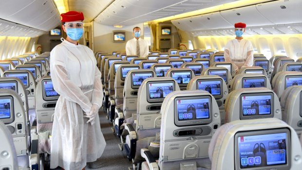 Emirates flight attendants will wear personal protective equipment on board planes.