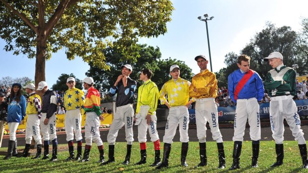 Jockeys pose for the cameras before the Cox Plate.