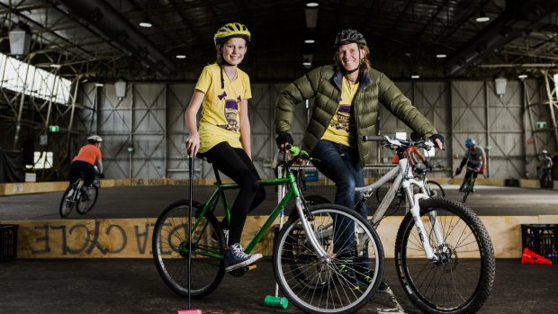 Ella Cuthbert, 13, and her mother Tara Sutherland, both of Watson, at the Canberra Bike Polo Tournament. 