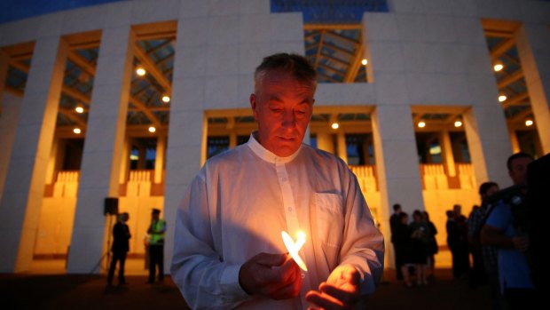 Andrew Stojanovski during the candlelight vigil .