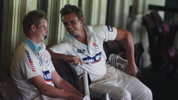 Back in the day: Steve Smith and Steve O'Keefe share a joke during a Sheffield Shield game at the SCG in 2009.