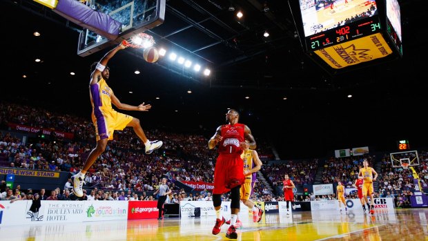 Flying high: Josh Childress slams down a breakaway dunk against Wollongong.