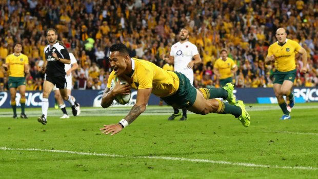 Flying start: Israel Folau of the Wallabies scores an early try against England.