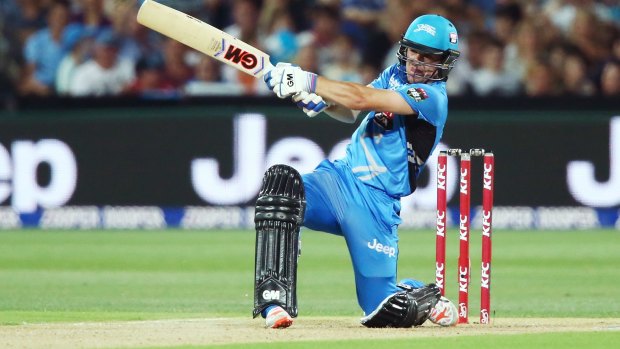 Six shooter: Travis Head of the Adelaide Strikers smashes another maximum against the Sixers.