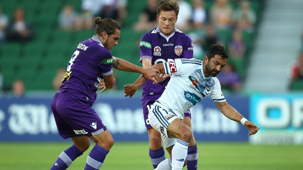 Fahid Ben Khalfallah of the Victory finds himself up against Josh Risdon and Chris Harold of the Glory.