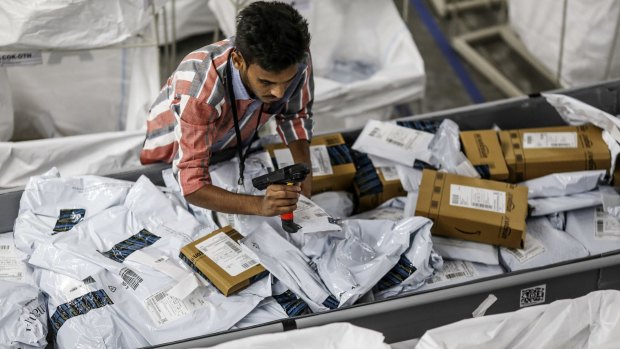 One in half a million: An employee scans a package at an Amazon.com Inc fulfillment centre in Hyderabad, India.