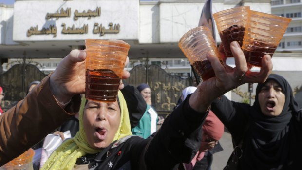 Supporters of former dictator Hosni Mubarak celebrate the verdict with sherbet drinks at Maadi Military Hospital.
