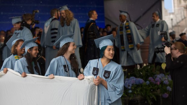 Emma Sulkowicz leads a group carrying a mattress during Class Day for seniors at Columbia University in 2015. To protest the school's handling of her sexual assault complaint against a classmate, Sulkowicz  carried a mattress around campus all year.