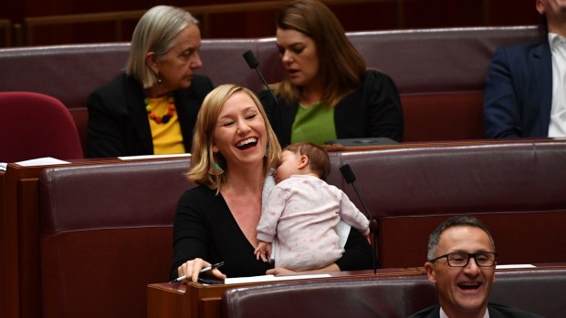 Greens co-deputy leader Larissa Waters soothes baby Alia Joy after breastfeeding her in the Senate.