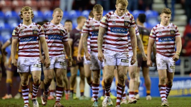 Walk away  Wigan players leave the field after losing the World Club Series match between Wigan Warriors and Brisbane Broncos
