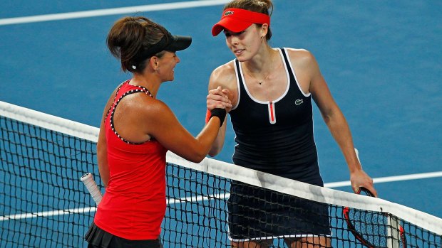 Hard court: Casey Dellacqua of Australia congratulates Alize Cornet of France