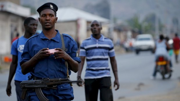 Police patrol the streets of Musaga, in Burundi's capital Bujumbura, after the results were released.