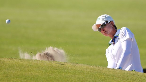 Catching up: Karrie Webb hits an approach shot on the 10th hole. 