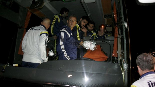 Attacked: Fenerbahce players in the team bus that was shot en route to Trabzon airport.