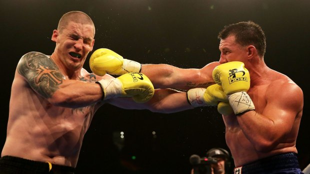 Punching on: Paul Gallen (r) in action against Randall Rayment during their heavyweight bout last year.
