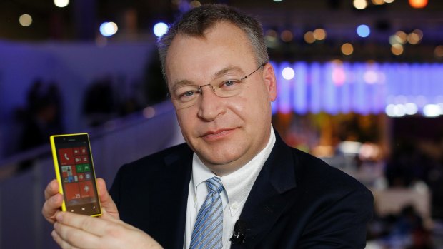 Nokia Chief Executive Stephen Elop presents up a new phone.