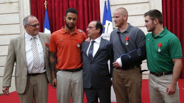 President Francois Hollande (centre) presenting Anthony Sadler, Spencer Stone and Alek Skarlatos with Legion of Honour medals. 