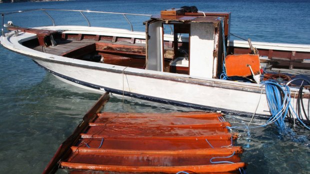 A vessel used by refugees is seen docked at the village of Kokkari on the eastern Greek island of Samos.