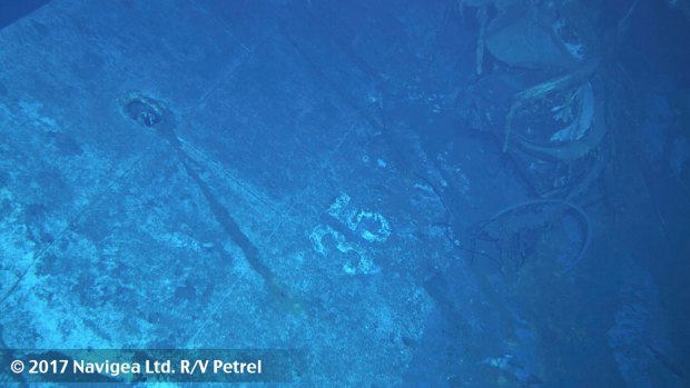 What appears to be the painted hull number "35" on the USS Indianapolis. Based on the curvature of the hull section, this seems to be the port side of the ship. 