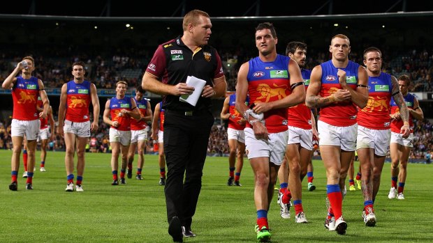 Lions coach Justin Leppitsch talks with Tom Rockliff after yet another defeat. 