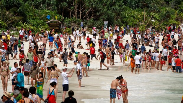 Crowds of people at Thailand's 'The Beach', Maya Bay.