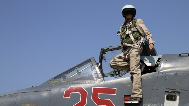 A Russian army pilot poses on the cockpit of SU-25M jet fighter. Russia has insisted its air strikes are targeting Islamic State and al-Qaeda's Syrian affiliates.
