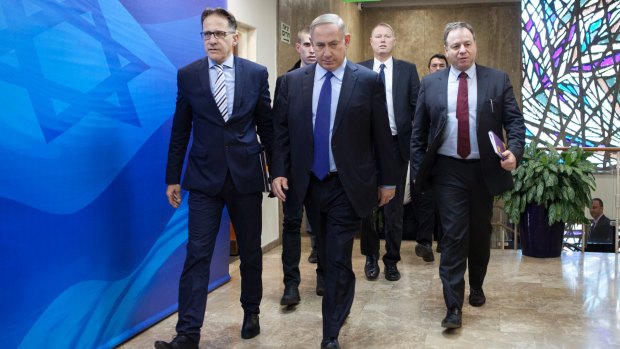 Israeli Prime Minister Benjamin Netanyahu, centre, arrives for a weekly cabinet meeting in Jerusalem on Christmas Day.