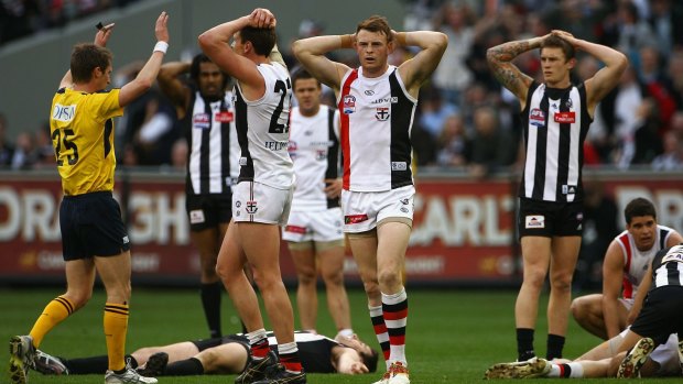 No winners: Collingwood and St Kilda players react to the drawn grand final in 2010.