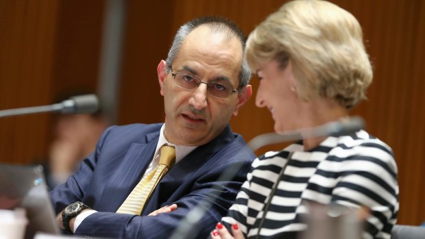 Secretary of the Department of Immigration and Border Protection Michael Pezzullo and Senator Michaelia Cash in discussion during estimates on Monday.