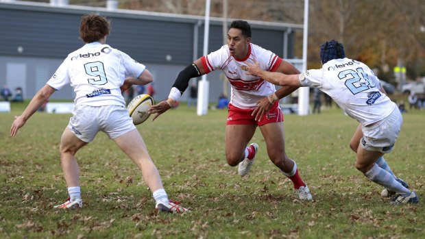 Tuggeranong Vikings outside back Nigel Ah Wong flick-passes to a teammate in his side's 29-24 win against the Queanbeyan Whites at Campese Oval on Saturday.