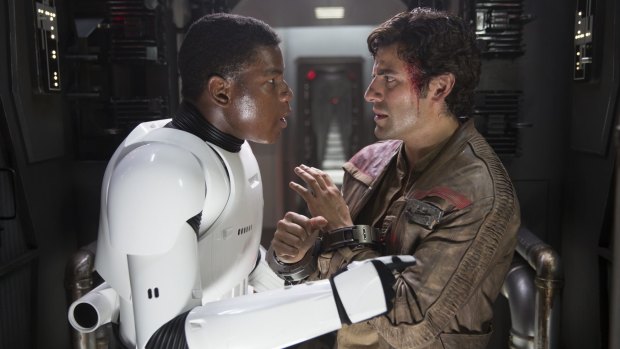 John Boyega, left, says the next <i>Star Wars</I> instalment will be considerably different in tone to the <i>The Force Awakens</I>, in which he starred with Oscar Isaac.