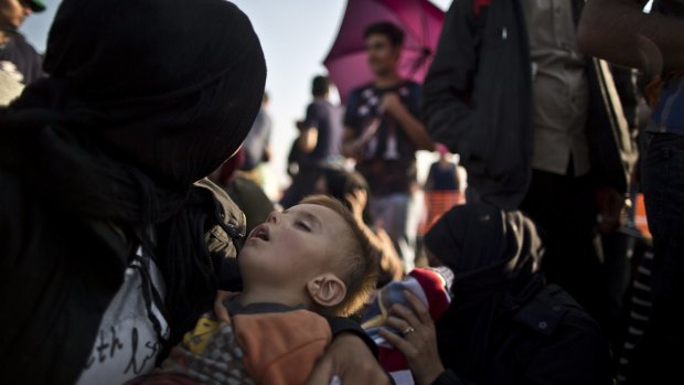 Syrians waiting near Roszke, southern Hungary, on Sunday.