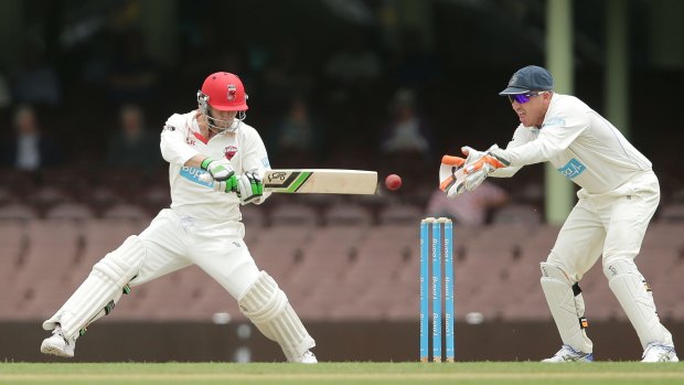In full flow: Phillip Hughes plays a trademark cut shot during his last innings for South Australia against NSW at the SCG on Tuesday.