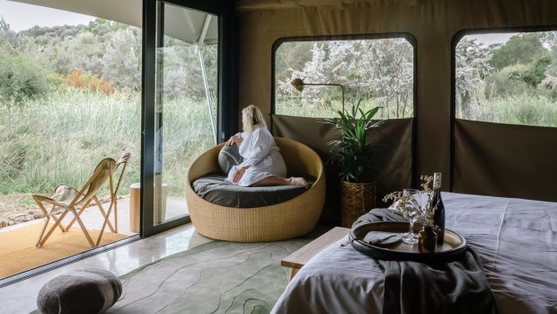 The tents, some of which overlook wetlands on the 16-hectare property, feature local timber, stone benchtops, private ensuite, walk-in wardrobe and a heated concrete floor using the geothermal waters.