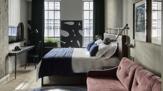 Rooms have a dark, moody palette and feature works by South African artists.