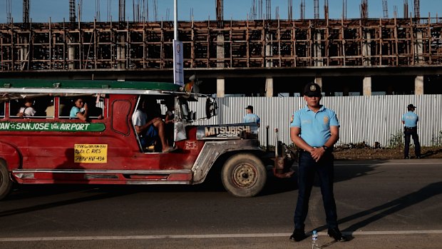 Prepared: Philippine National Police stand guard along the national highway during a security rehearsal ahead of the Pope's visit.