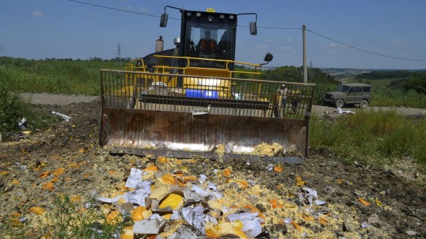 Illegally imported food is destroyed in the Belgorod region, Russia, on Thursday. 