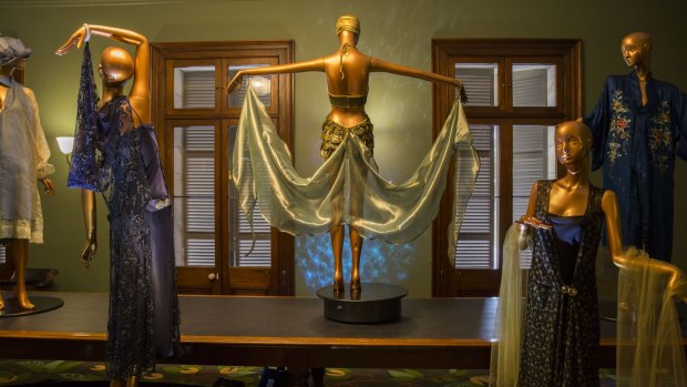 The costumes are draped over mannequins scattered throughout the heritage building. 