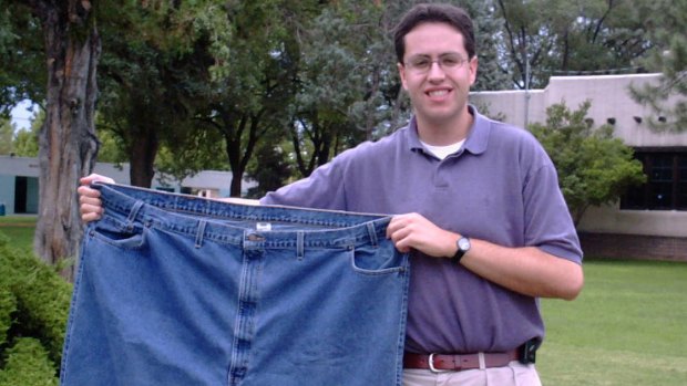 In this August 7, 2001 file photo, Jared Fogle holds up a pair of jeans he used to wear before losing weight.